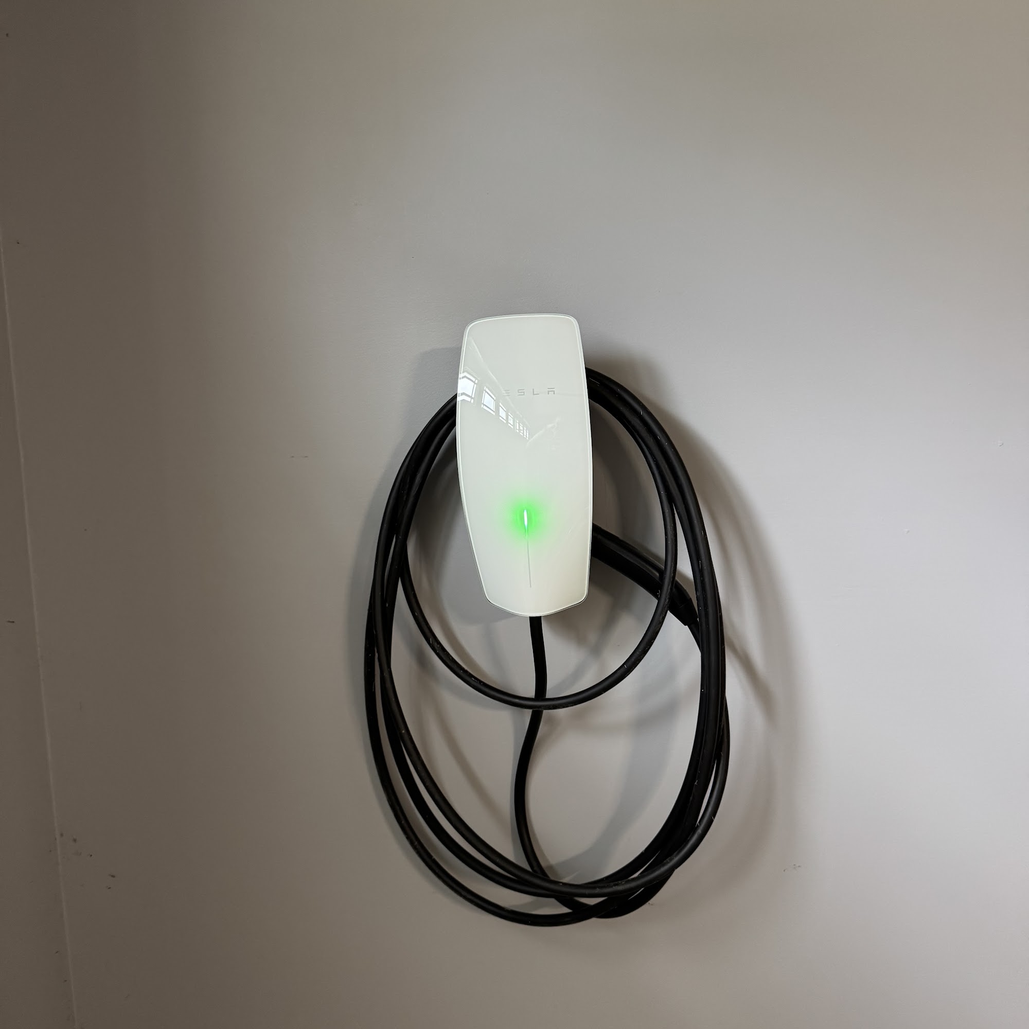 Wall-mounted home EV charger